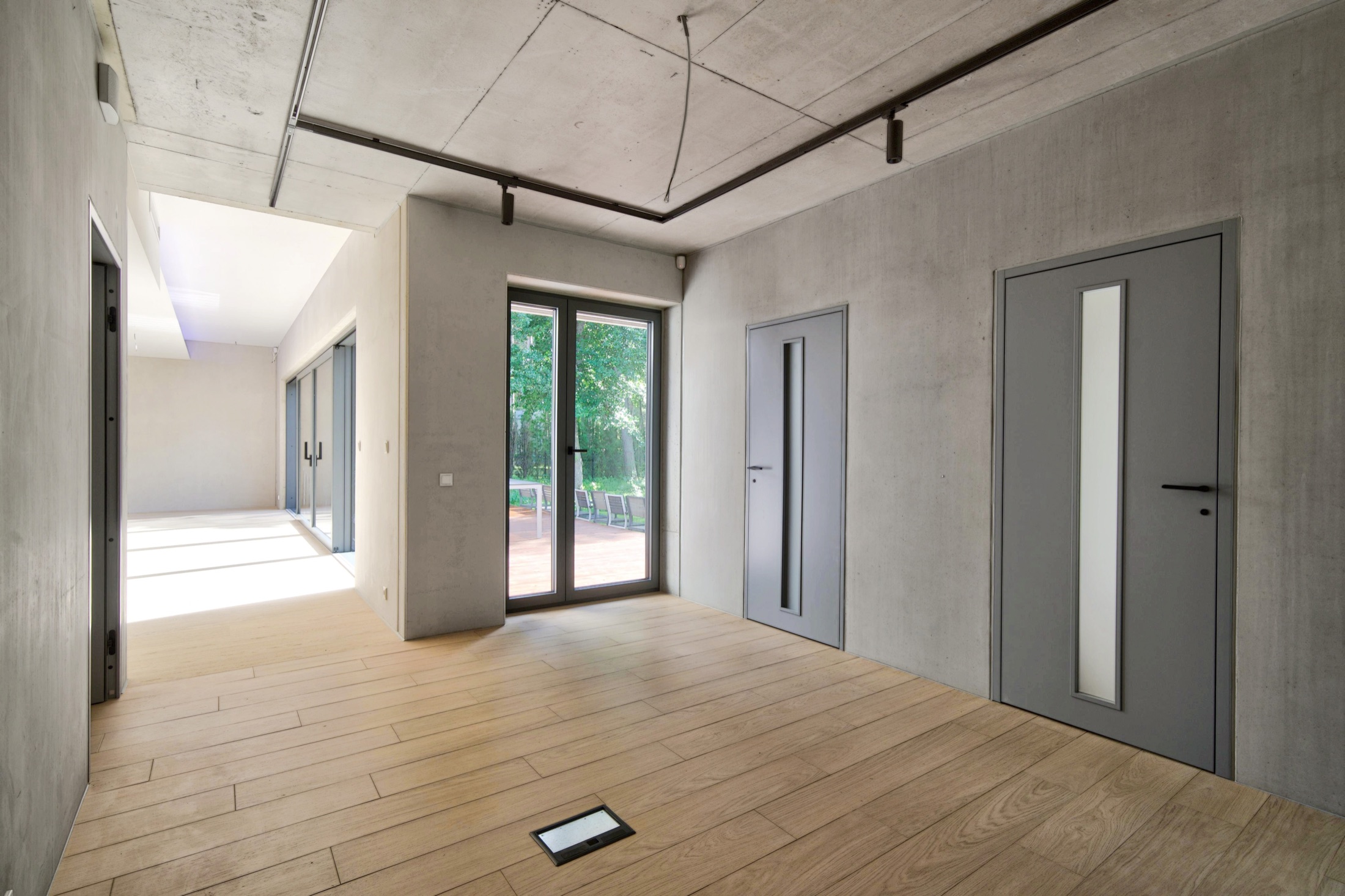 Concrete entrance hall and oak floor
