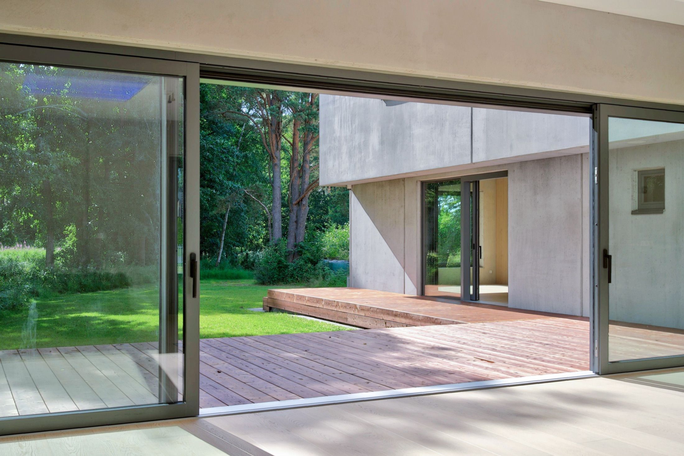 View through sliding doors to the terrace and garden